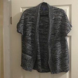 Woman’s short sleeved gray and black sweater